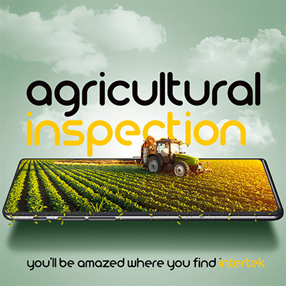 Farm tractor driving through field and superimposed on top of an electronic tablet computer