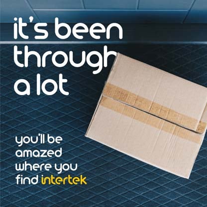 A cardboard box sitting at a doorstep