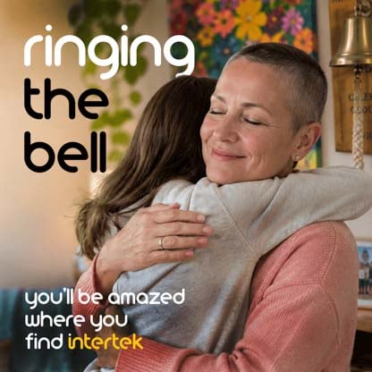 One woman hugging another woman with a shaved head.